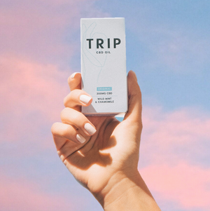 hand holding cbd oil
